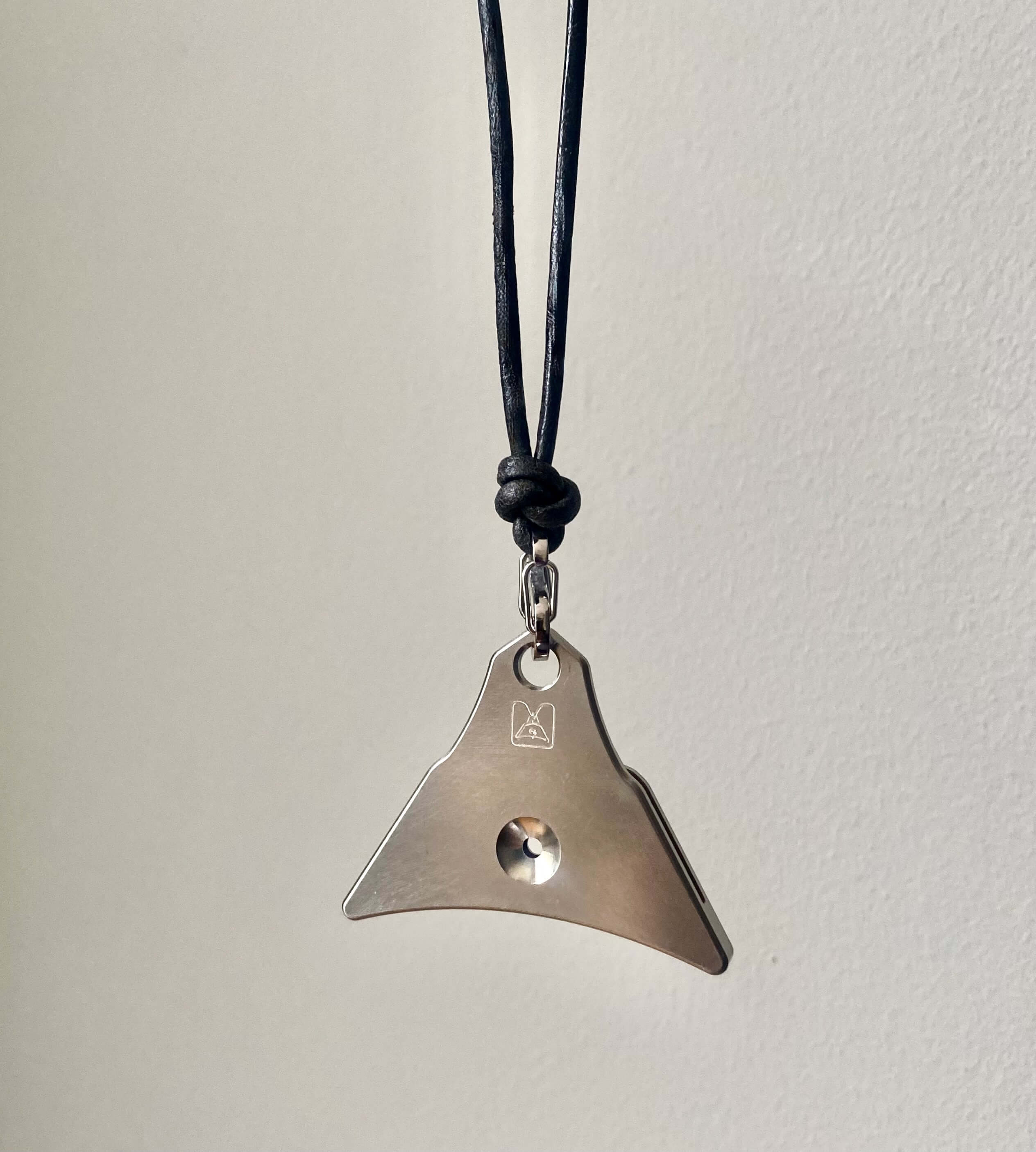 titanium whistle with Logan Whistle maker's mark