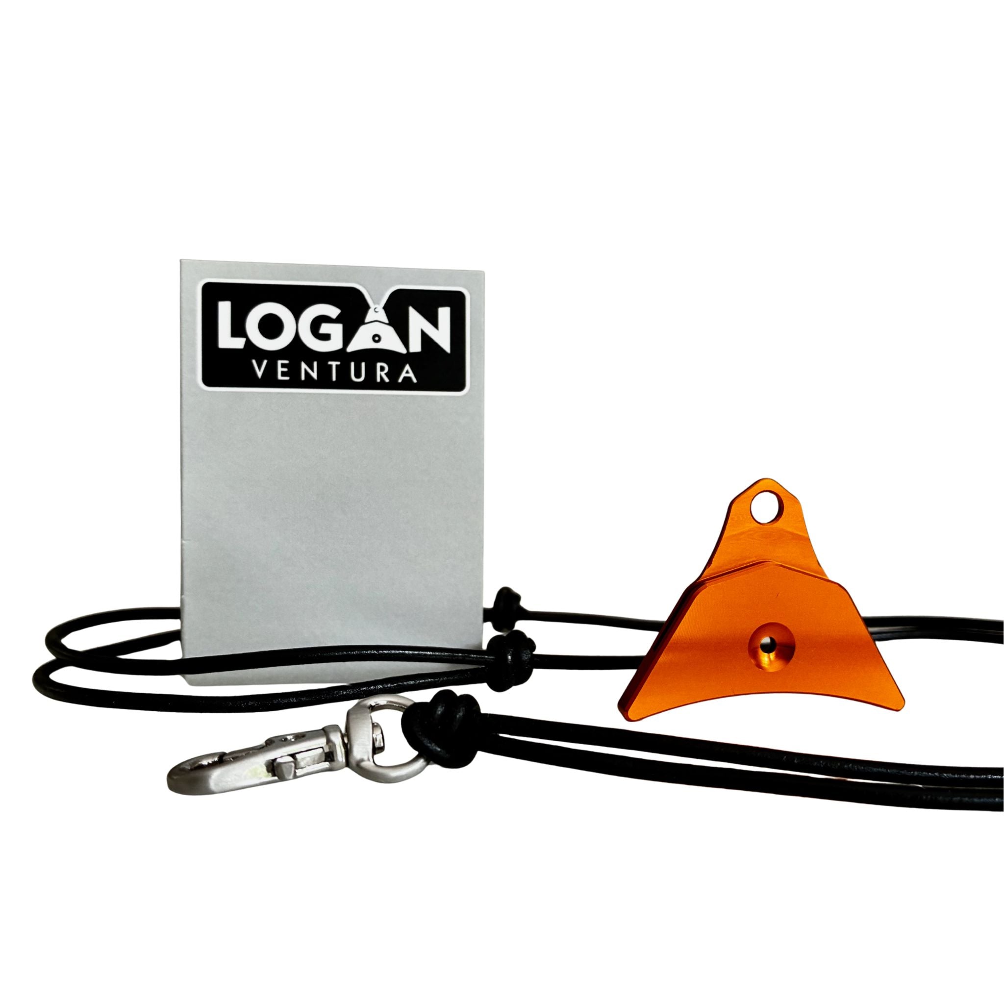 An orange Logan ventura sheepdog whistle attached to a black cord lanyard with a silver swivel clip, shown next to a silver label 'LOGAN VENTURA' on a white background.