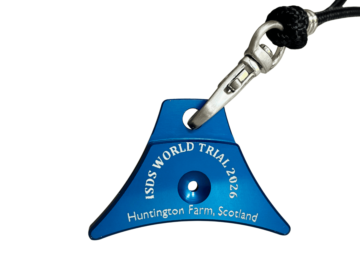 A blue Logan A1 sheepdog whistle engraved with 'ISDS WORLD TRIAL 2026 Huntington Farm, Scotland' on a white background.