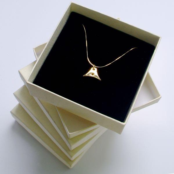 gold whistle charm on gold chain