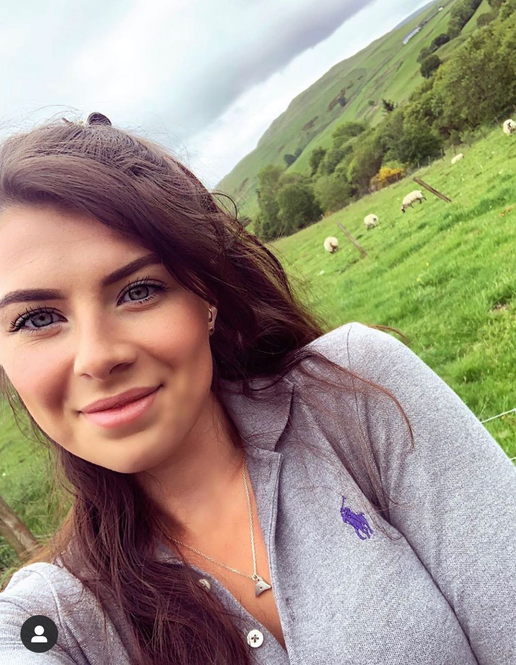 A woman wearing our Sterling Silver Sheepdog Whistle Charm Necklace