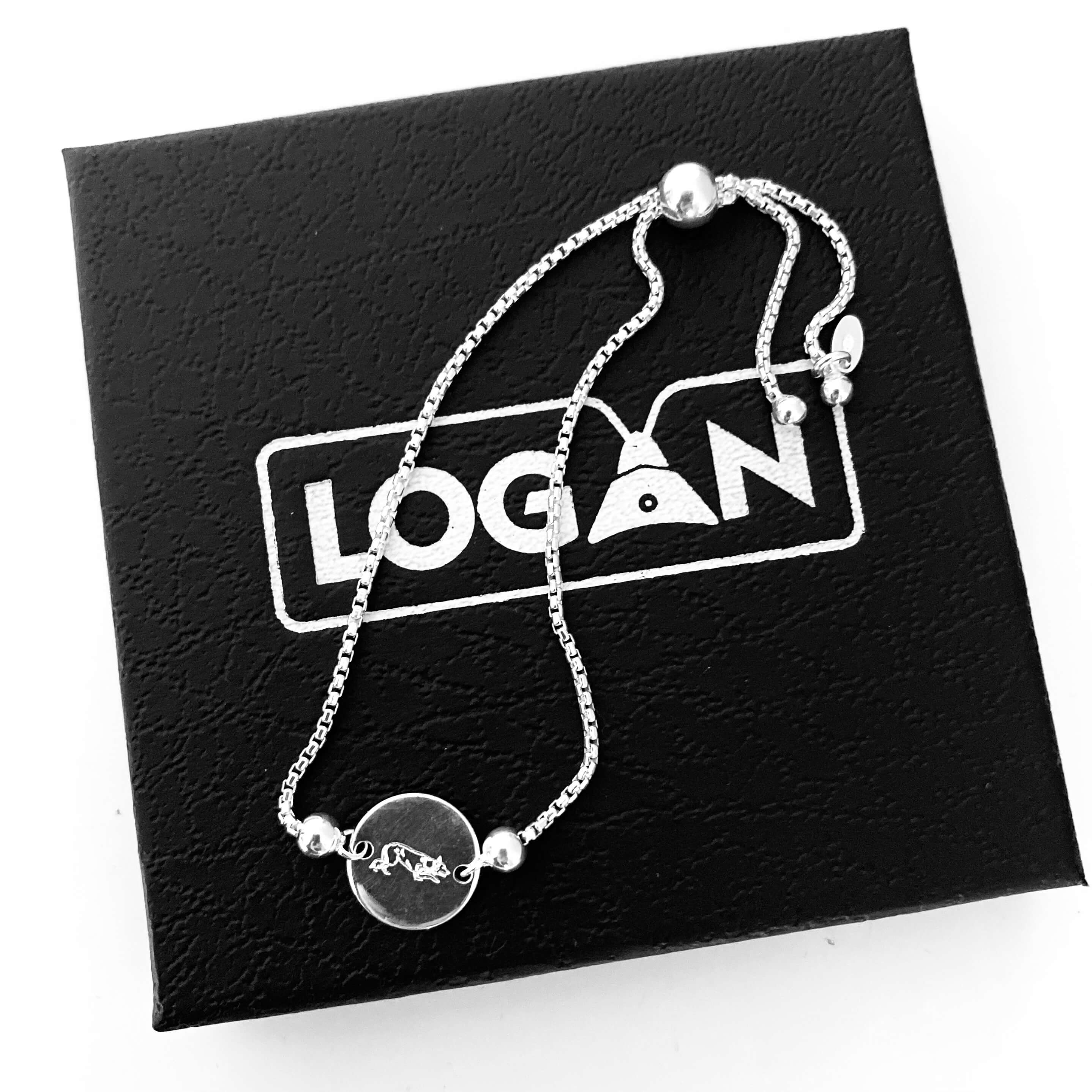 925 Silver bracelet with border collie engraving on a black card with 'LOGAN' branding