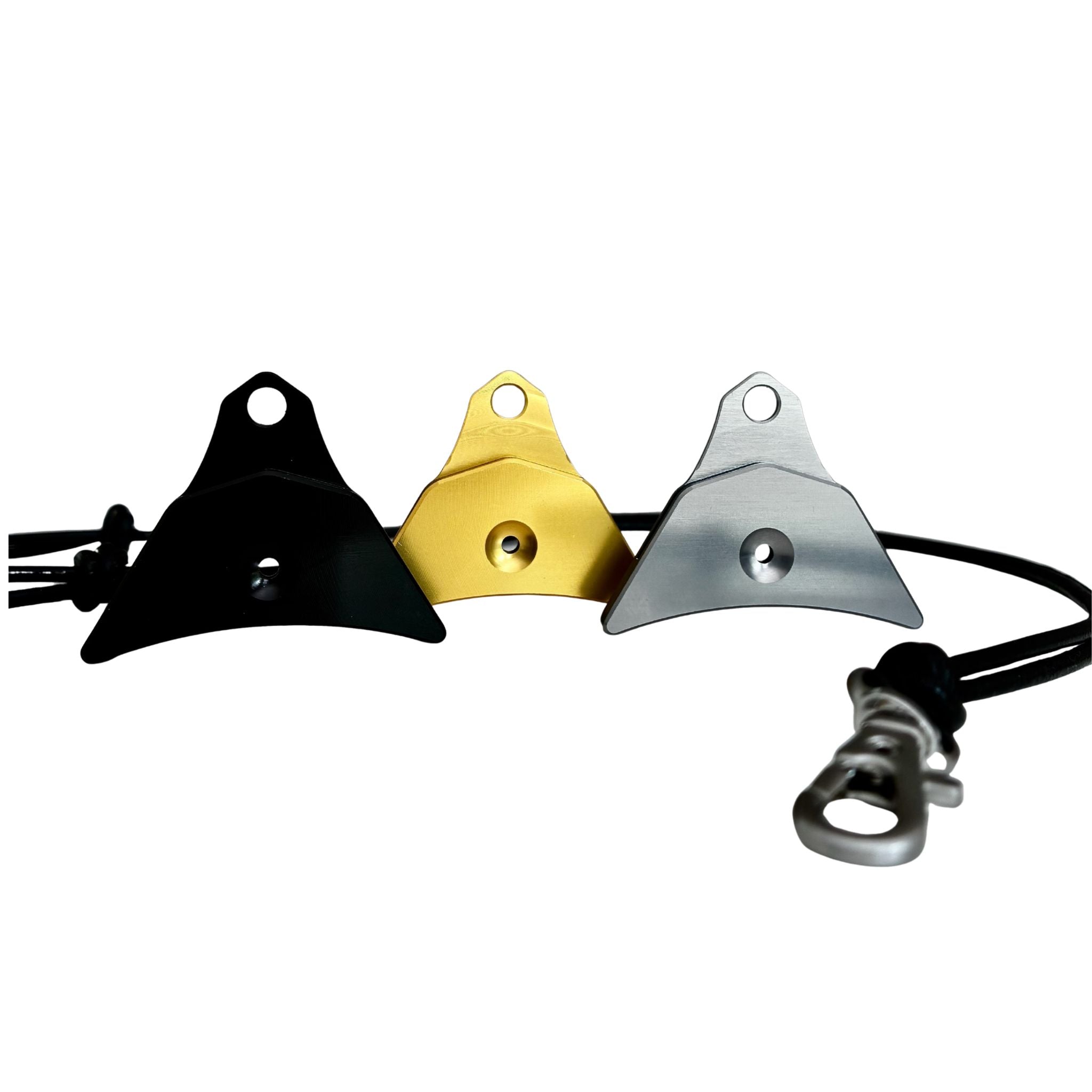 Three Logan ventura sheepdog whistle s and  a black leather cord lanyard with a silver swivel clip on a white background